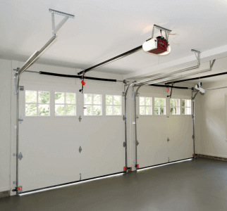 Interior view of double garage doors with small windows in the top.