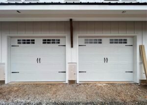 Newly installed white double car garage doors