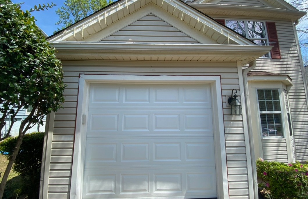 Image of a traditional white, single-car garage door